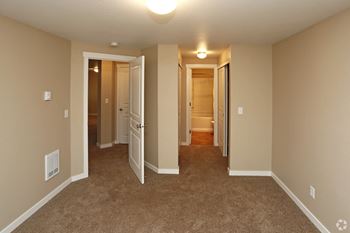 Walk through his and hers closets on the way to the master bath!